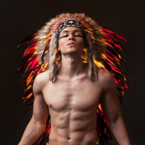 Indian strong man with traditional native american make up